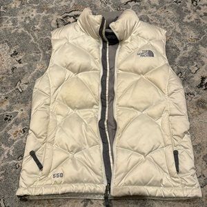 The NorthFace Creamy white vest.See pics for measurements. Goose down insulation